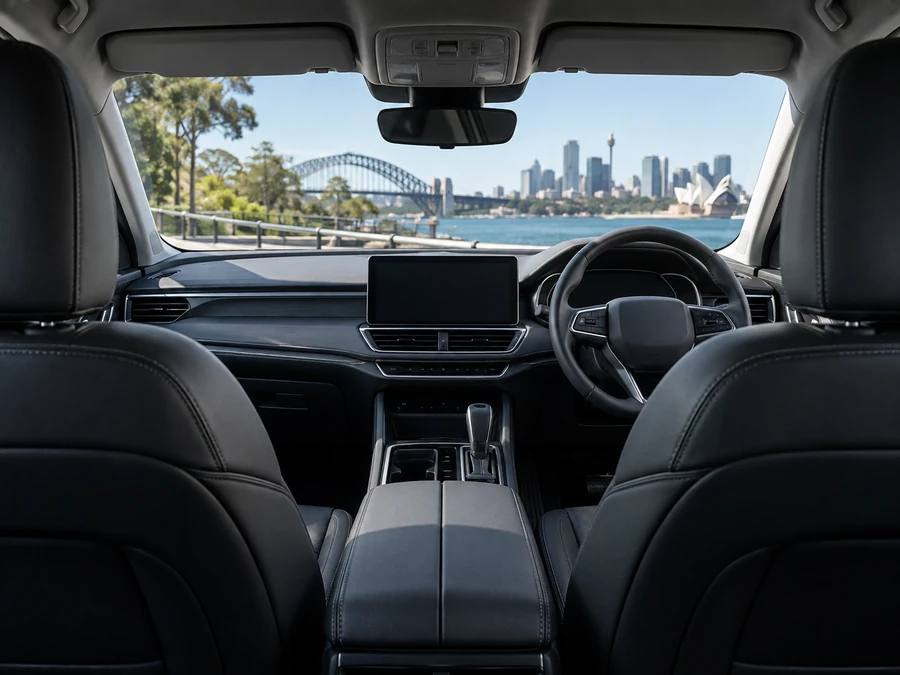 Interior of a premium sedan seen from the rear seat toward the dashboard