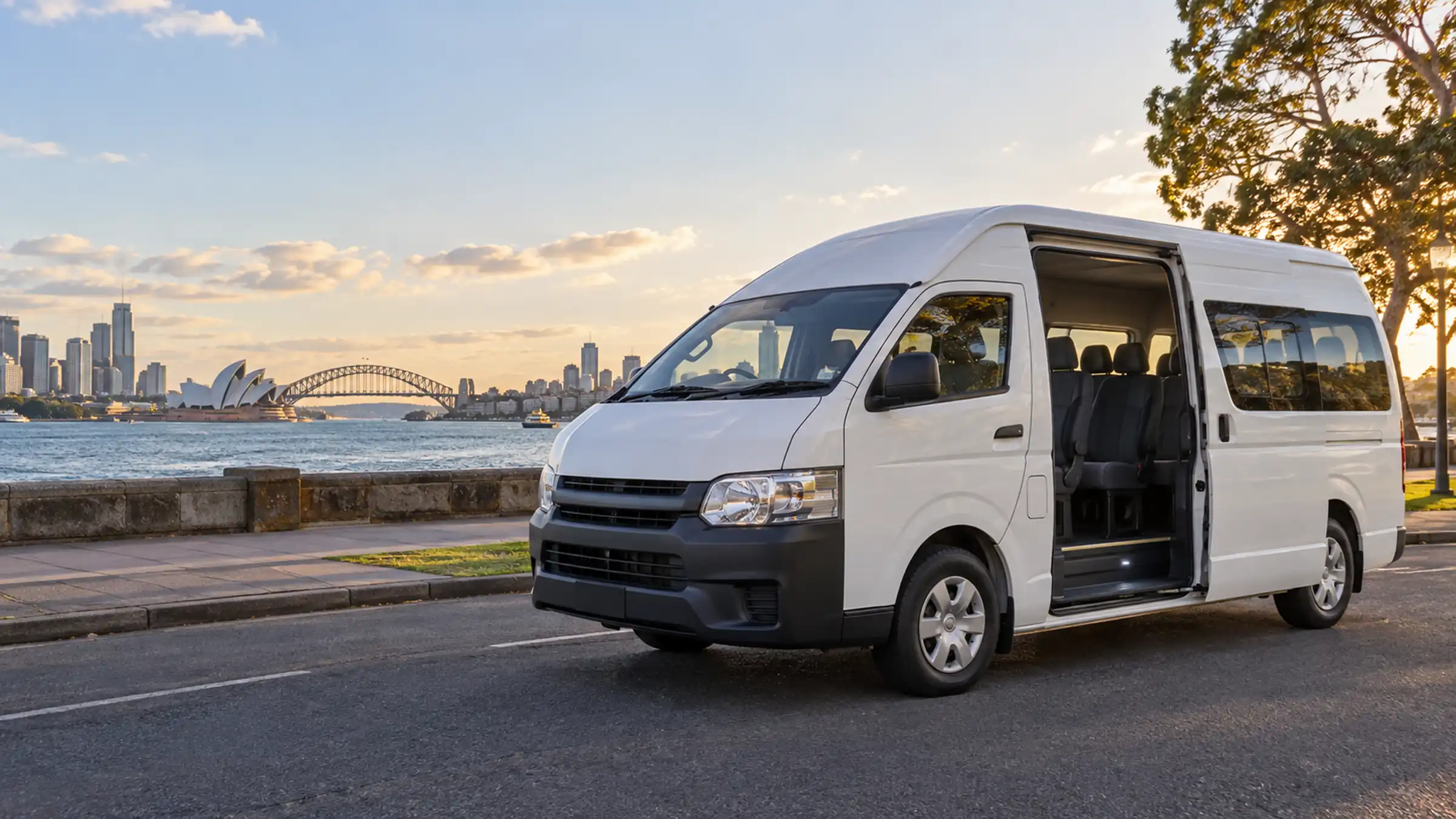 Eleven seat maxi van parked on a wide Sydney street with its side door open