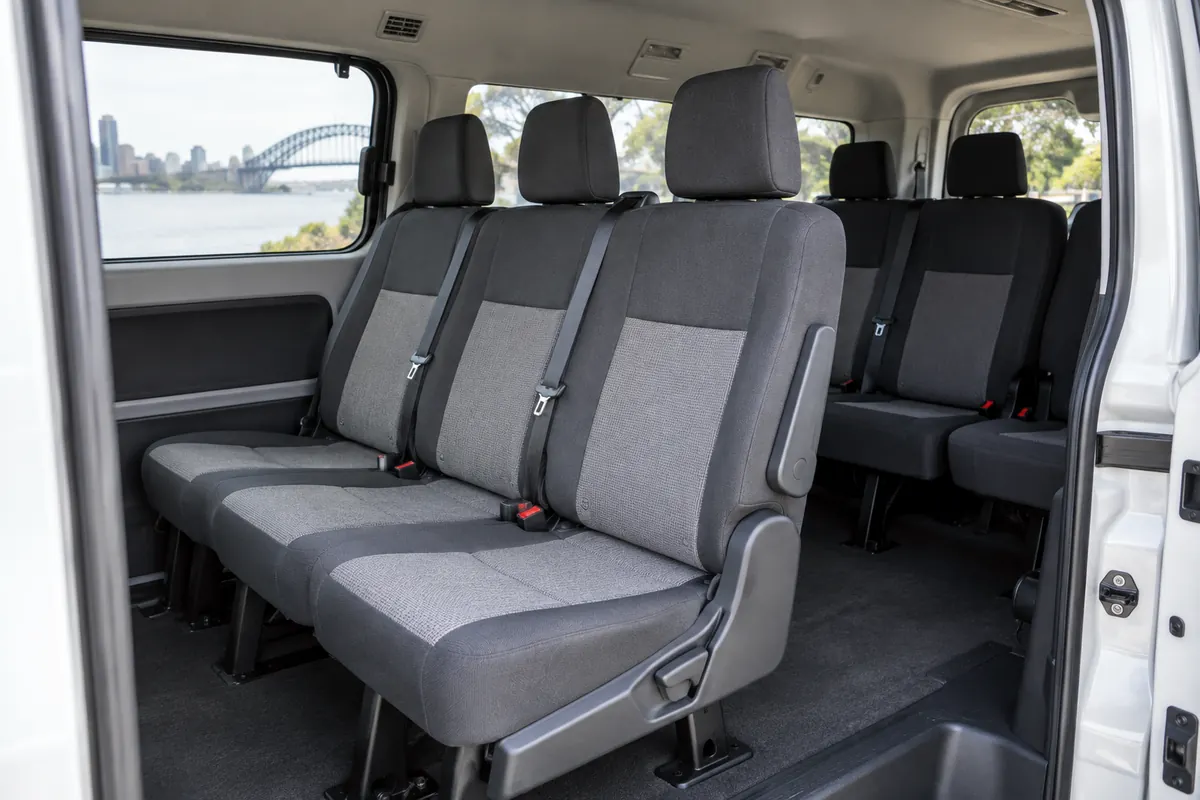 Interior of a clean seven seat maxi van seen from the open side door